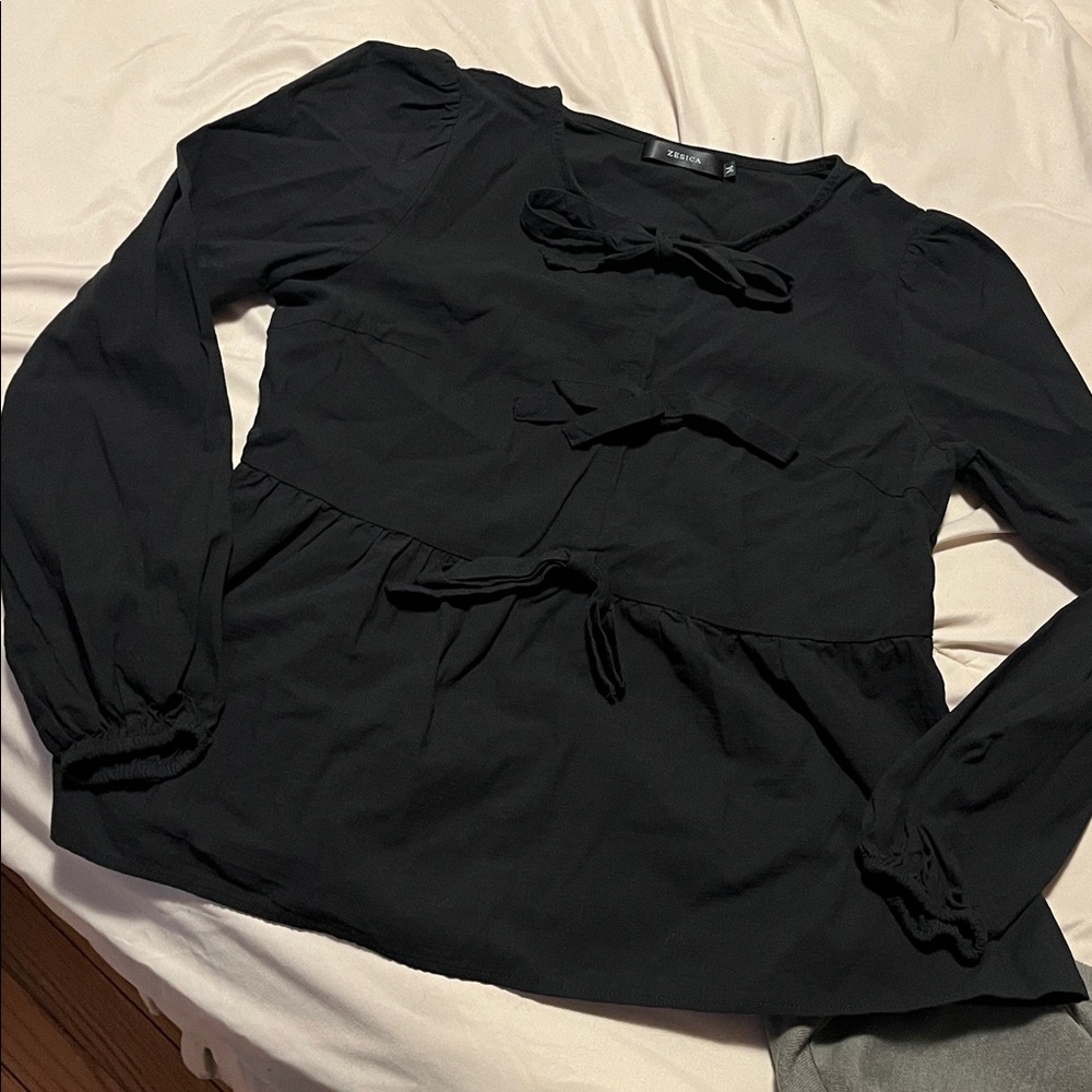 Black bow accent blouse size Medium. Never worn.